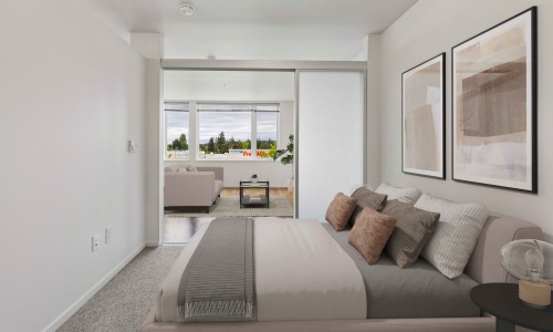 a bedroom with a bed and wall art