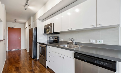 a kitchen with white cabinets