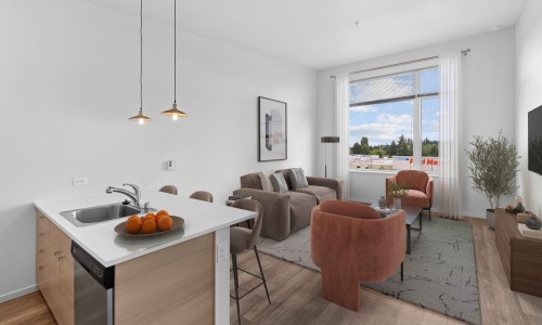 a living room with a couch and chairs